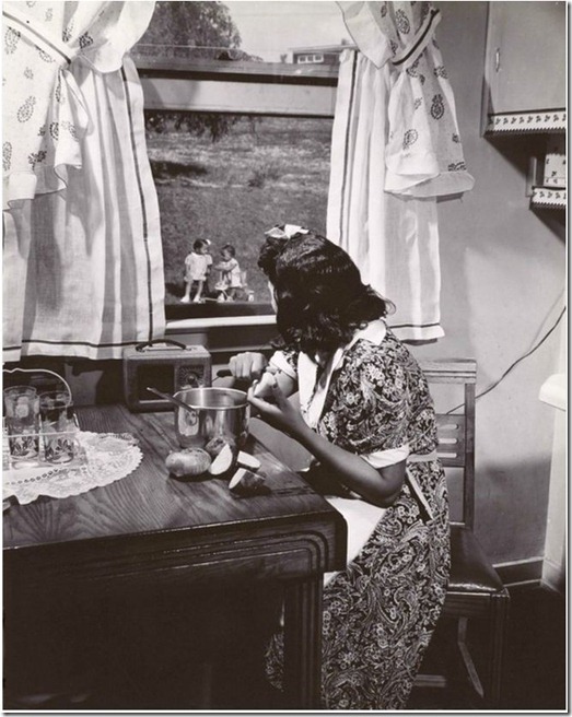1942 Anacostia Mother watching her kids while preparing dinner, Wash DC - Gordon Parks